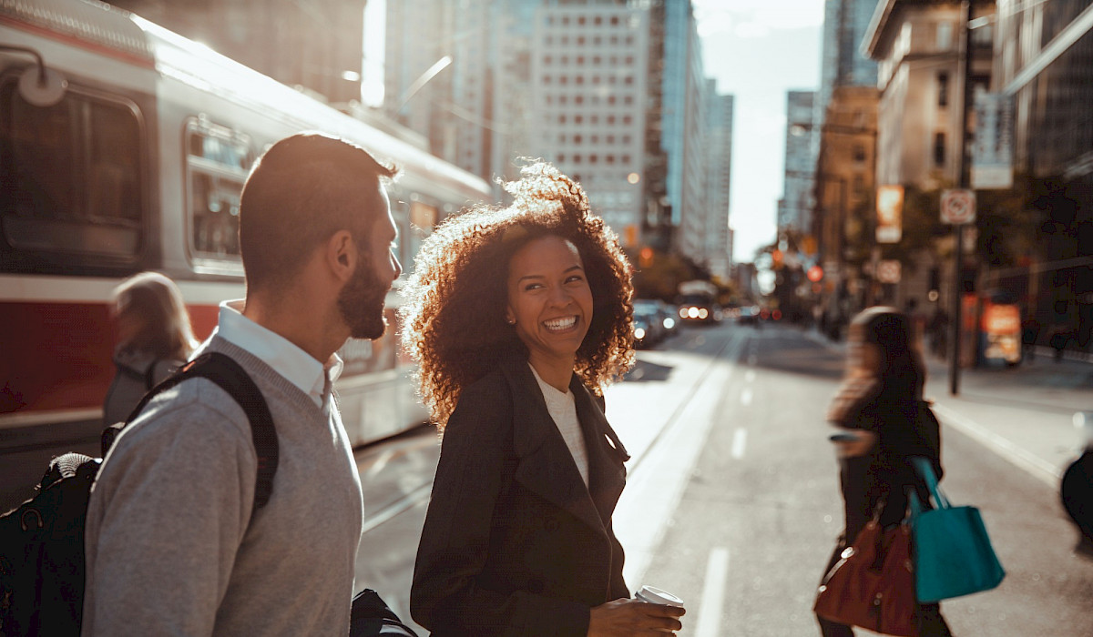 Image of women and man crossing the road in Toronto Canada